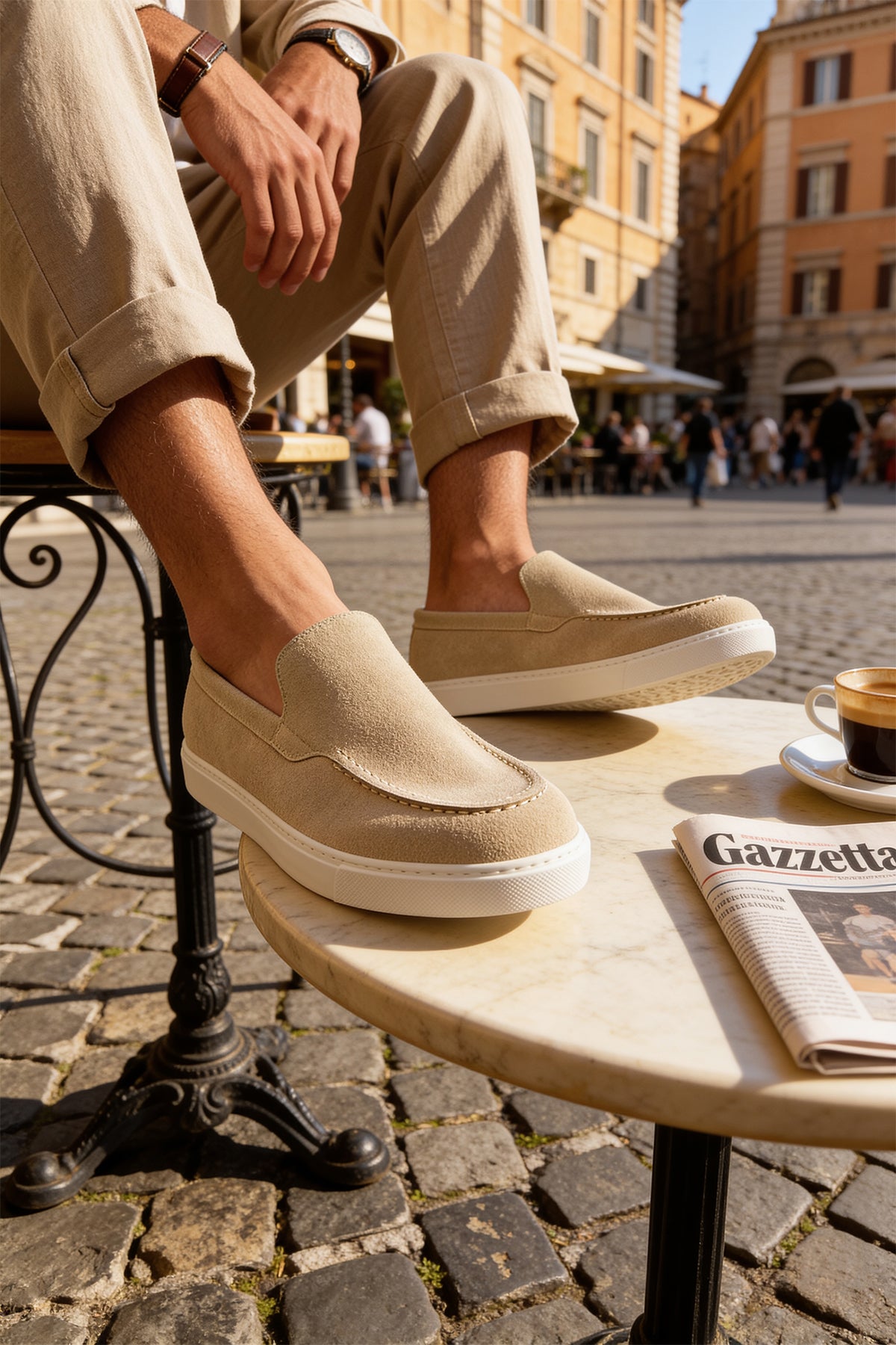 Beige suede slip-on loafers with tan panel detail and low white rubber sole