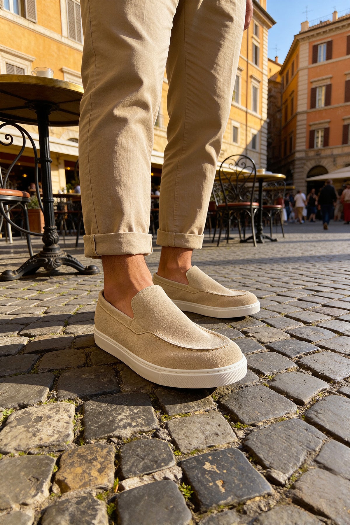 Beige suede loafers, angled side view with smooth vamp and stitched edges