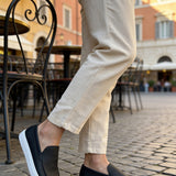 Black leather-look loafers with white soles, rear side angle