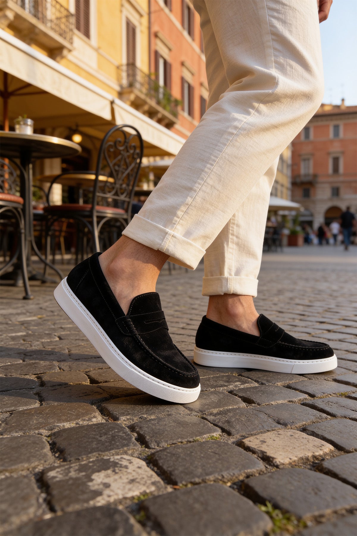 Black suede loafers, white rubber outsole, clean slip-on upper