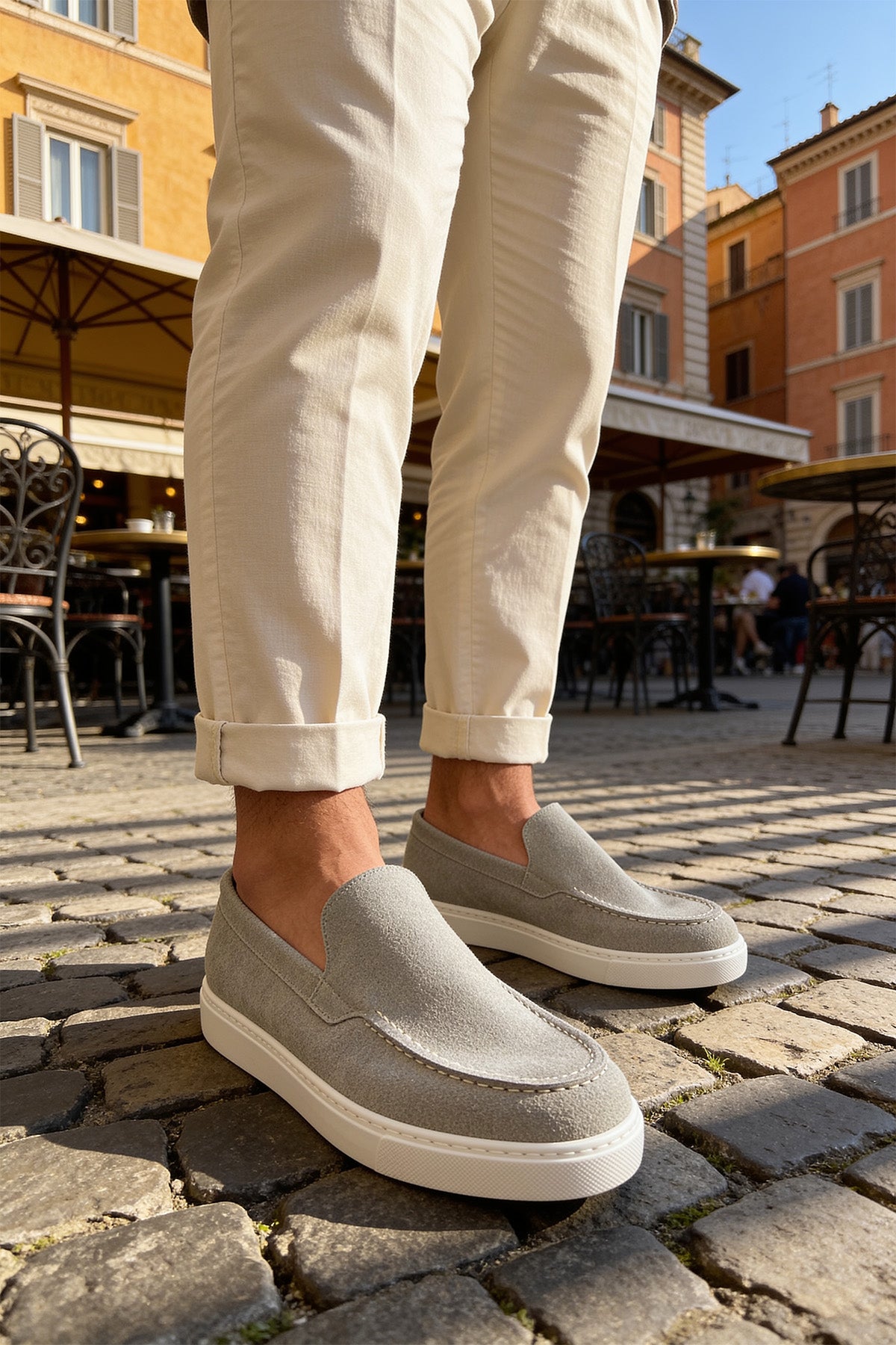 Men's gray suede loafers, textured upper with moc-toe stitching and white cupsole
