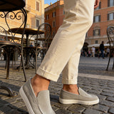 Men's gray suede loafers with stitched vamp panel and white rubber outsole