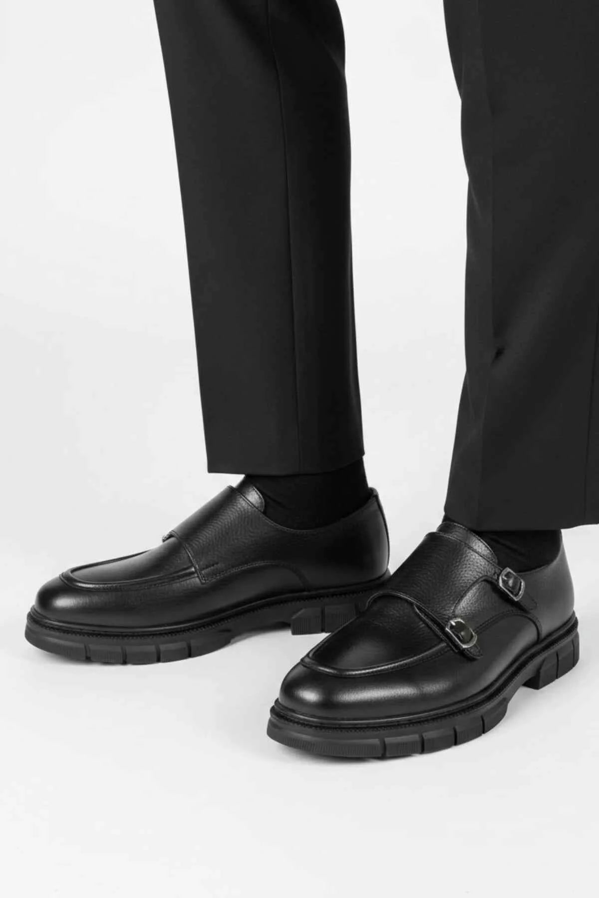 Black leather monk strap shoes with rounded toe and double buckles
