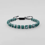 Turquoise stone-look beaded bracelet with black cord and sliding clasp
