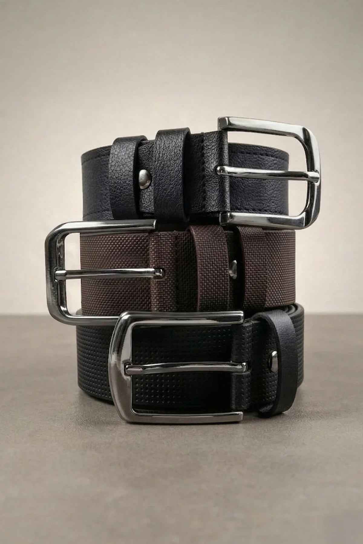 Men's 3-pack casual belts in brown, black, and navy with silver metal buckles