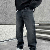 Dark charcoal baggy jeans, relaxed straight leg, belt loops, five-pocket style