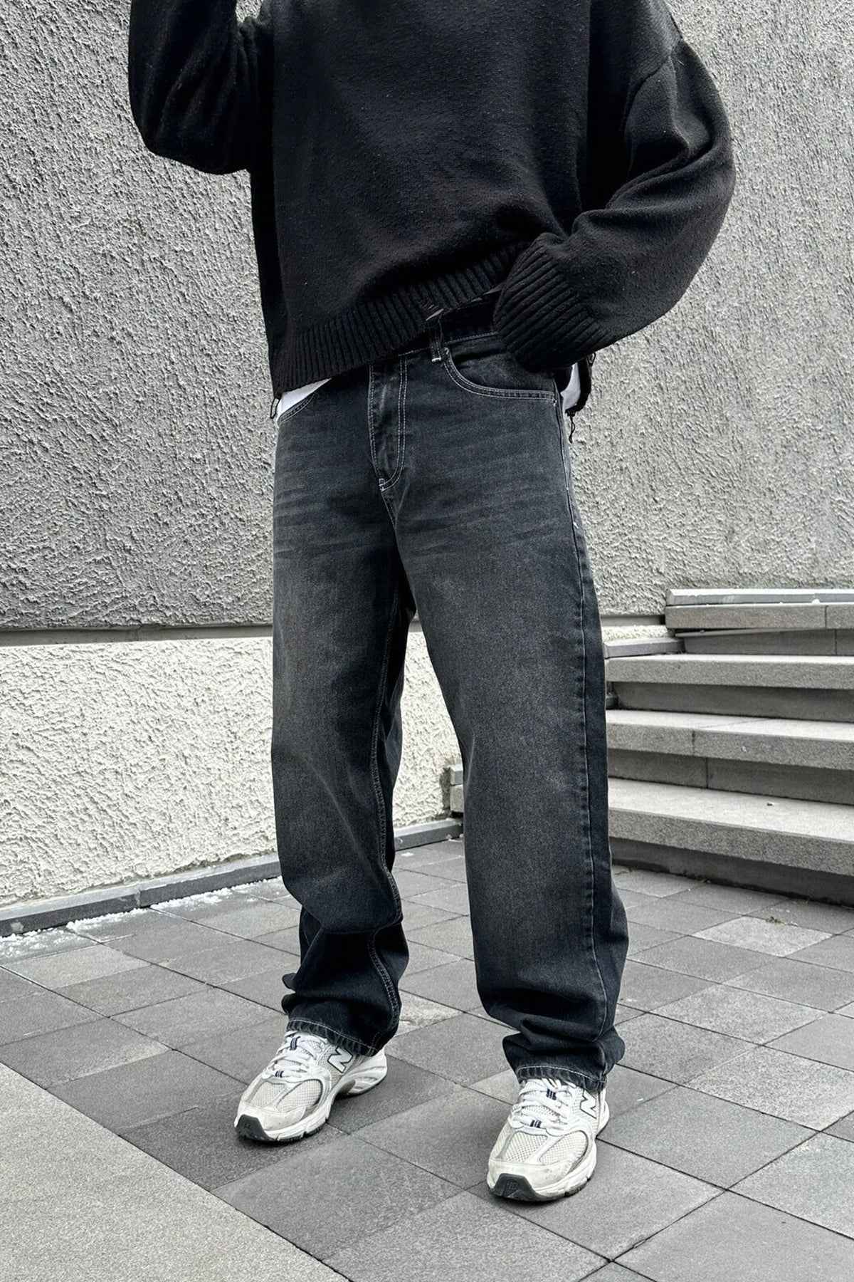 Dark charcoal baggy jeans, relaxed straight leg, belt loops, five-pocket style
