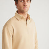 Men's beige relaxed-fit crewneck sweatshirt, front view with ribbed cuffs and hem