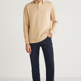 Men's beige relaxed-fit crewneck sweatshirt, side view with long sleeves and ribbed hem