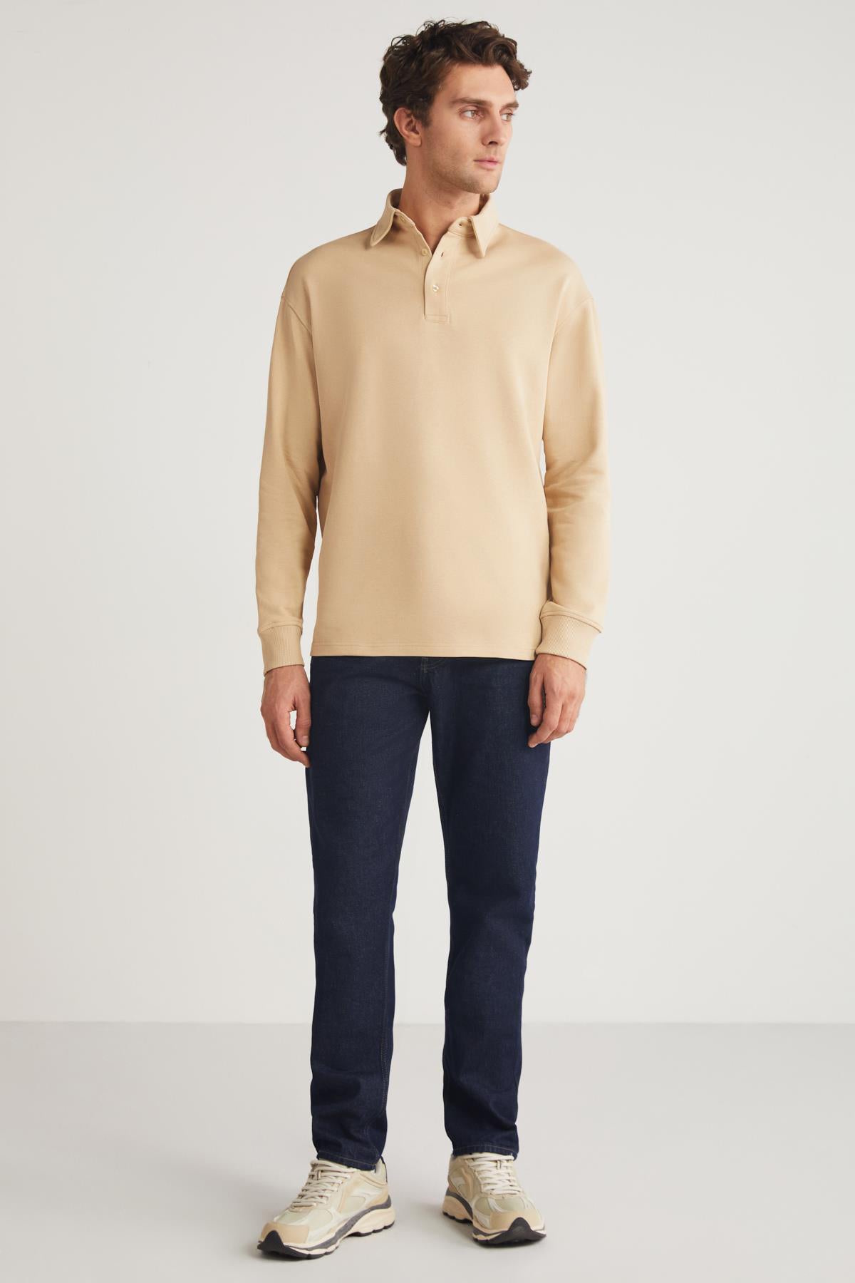 Men's beige relaxed-fit crewneck sweatshirt, full front view with ribbed collar and cuffs