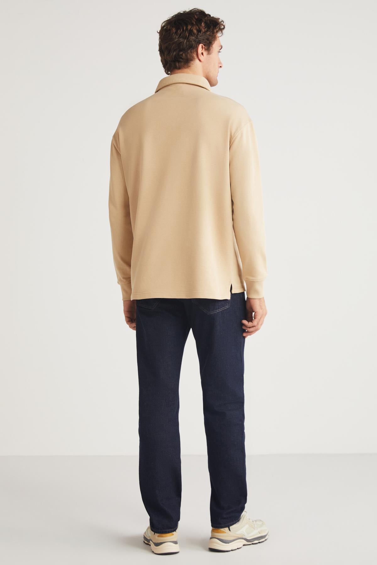 Men's beige relaxed-fit crewneck sweatshirt, back view with long sleeves and ribbed cuffs