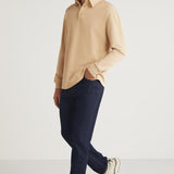 Men's beige relaxed-fit crewneck sweatshirt, side walking pose with crew neckline