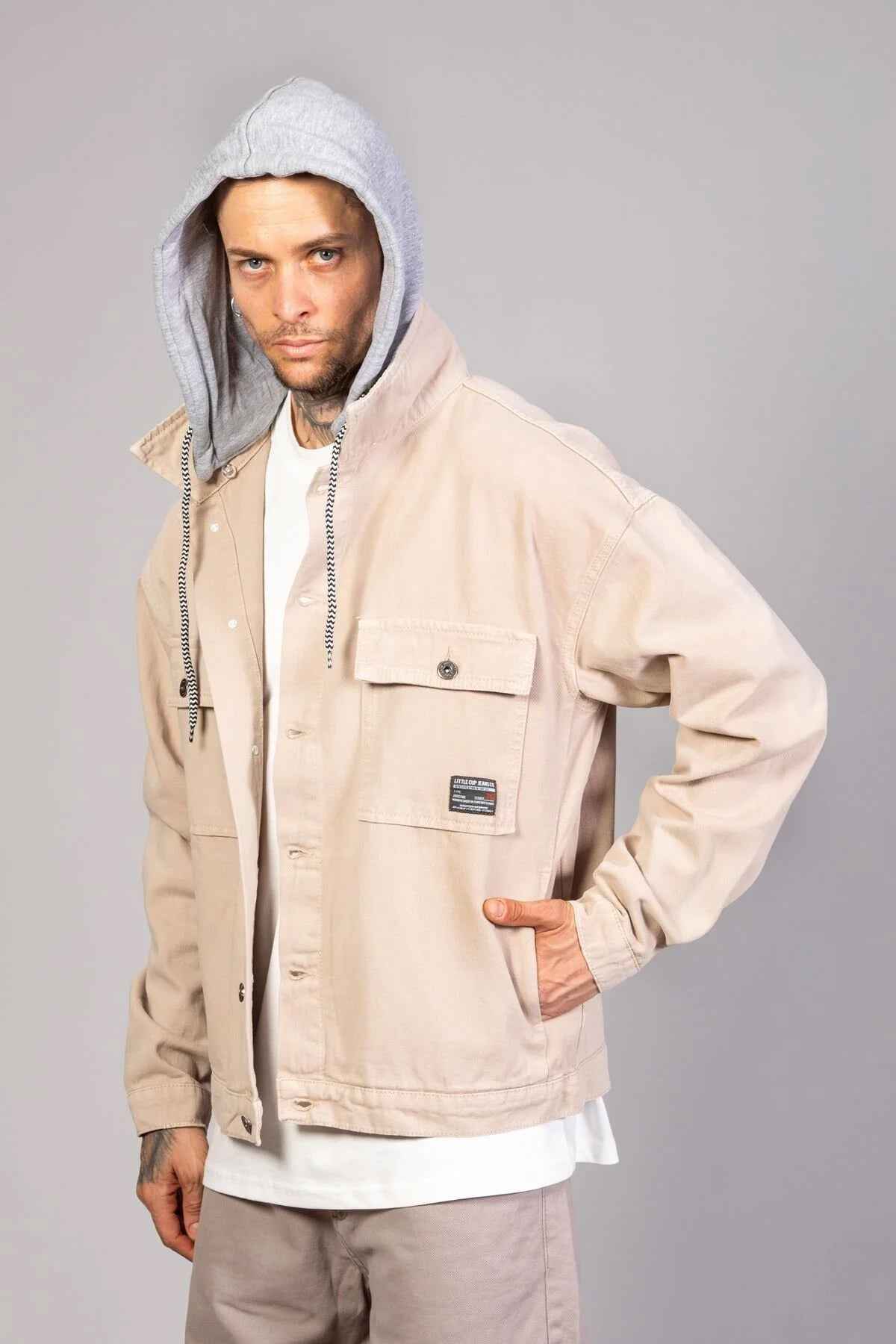Beige oversized hooded jacket with snap front, chest pocket and LTC patch