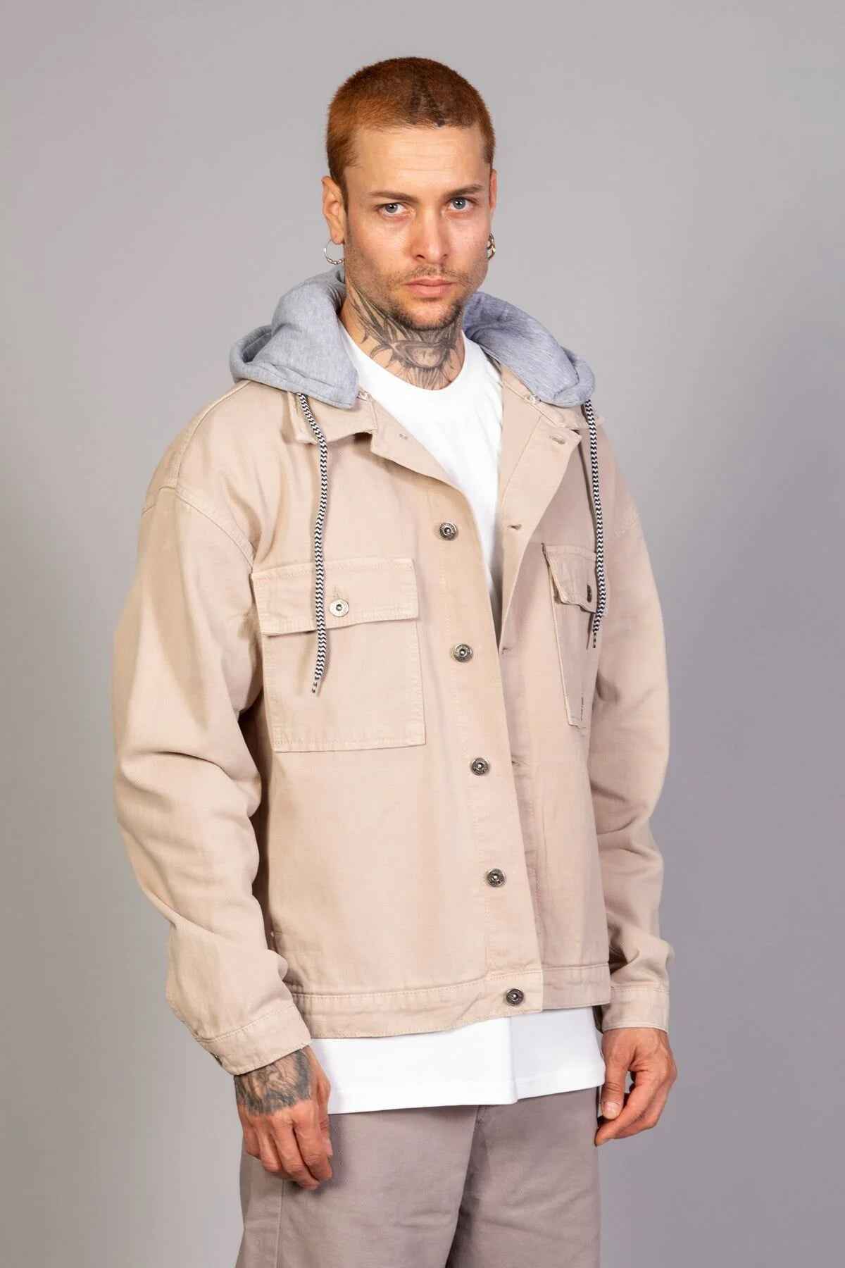 Beige oversized jacket with button front, two chest flap pockets and hood, LTC patch