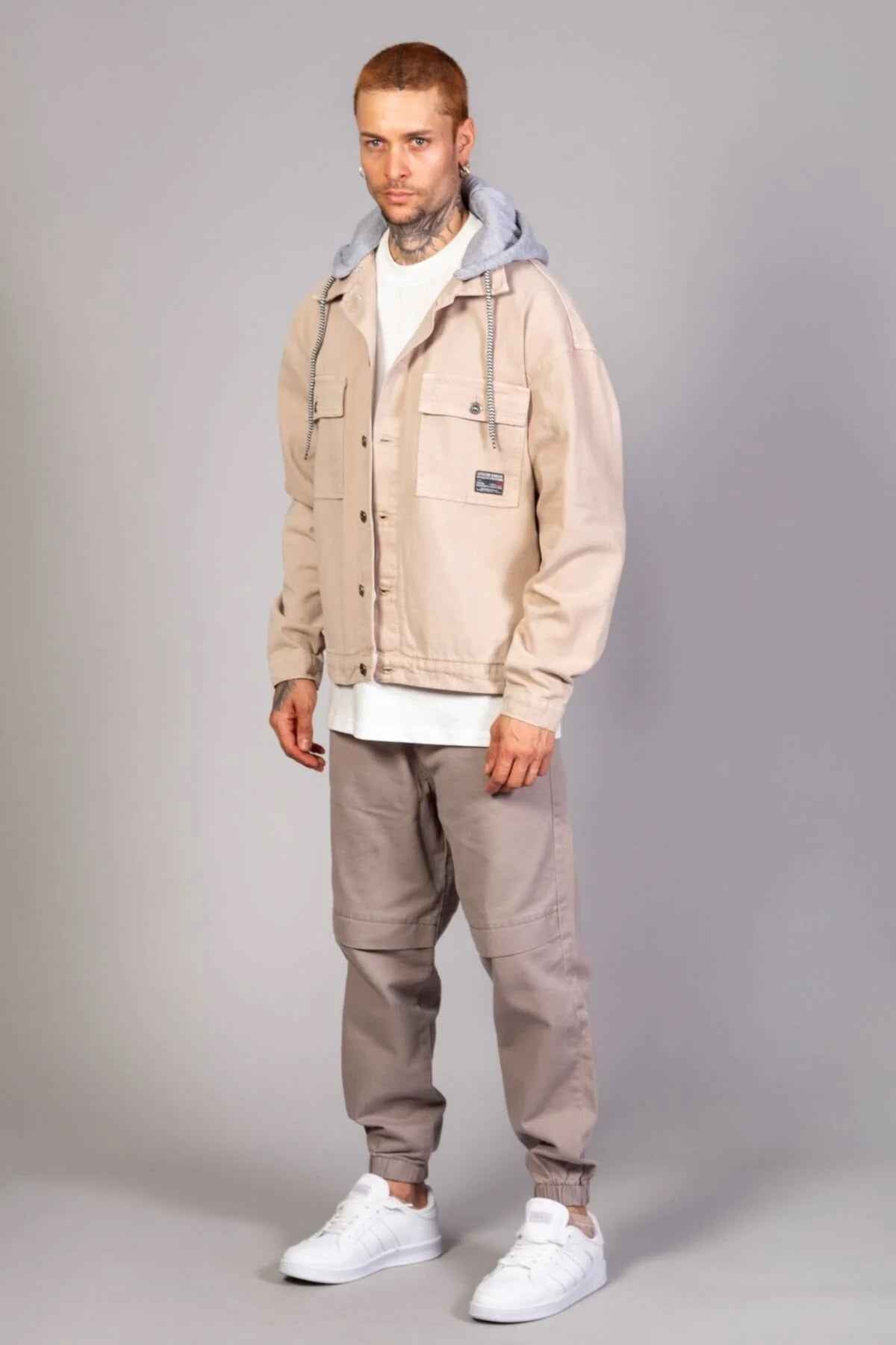 Beige oversized hooded jacket with snap button closure, chest pocket and LTC logo patch