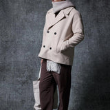 Men's oversized light beige double-breasted coat with wide lapels and front buttoning