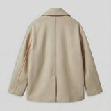 Light beige double-breasted coat back view with notch-stitched collar and center seam