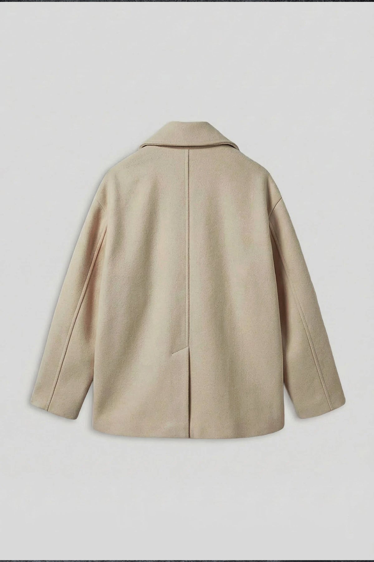 Light beige double-breasted coat back view with notch-stitched collar and center seam