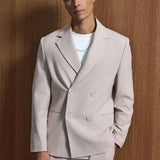 Men's beige oversized suit, front close-up: double-breasted blazer and trousers