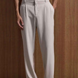 Beige oversized suit trousers with belt loops and straight-leg fit
