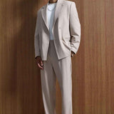 Men's beige oversized suit, full front: tailored blazer and straight-leg trousers