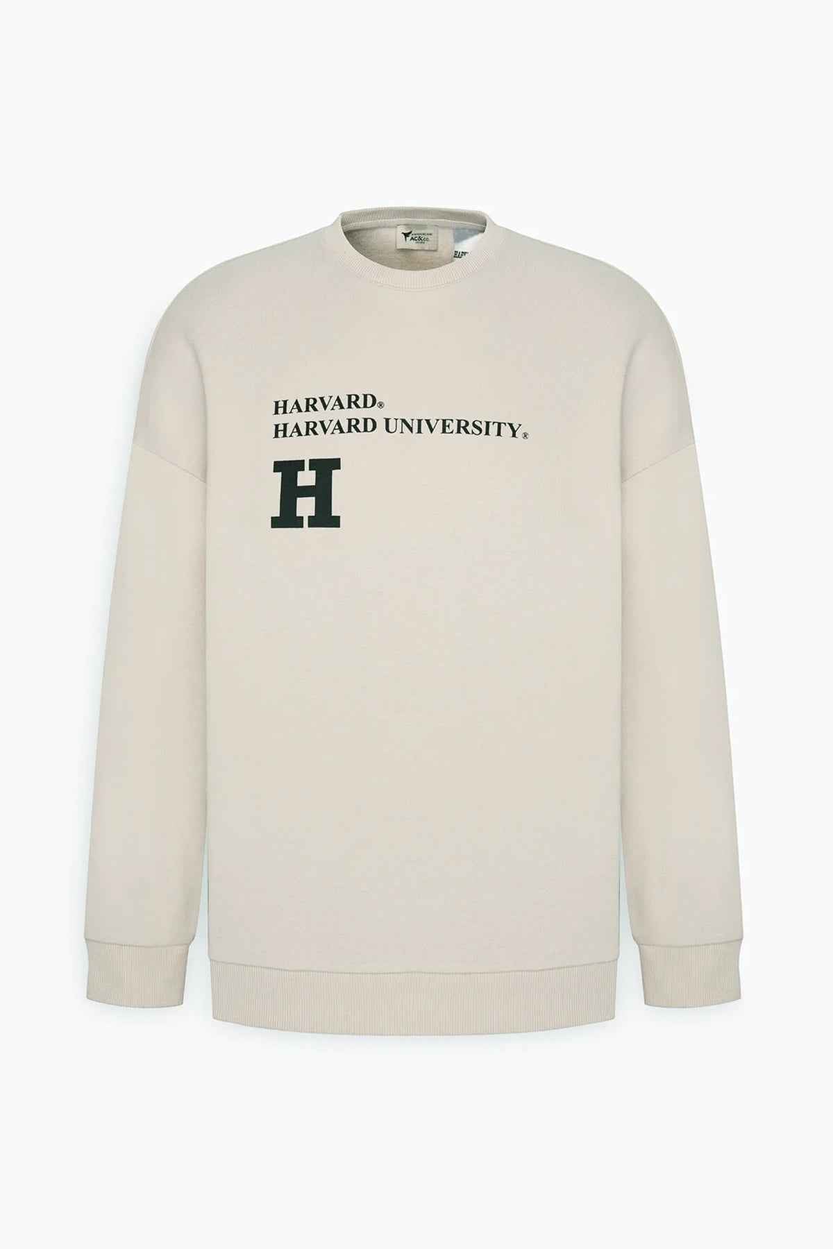 Beige oversized sweatshirt with Harvard chest logo, flat lay