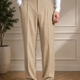 Men's beige tailored pants with black belt, pleated front, side pockets