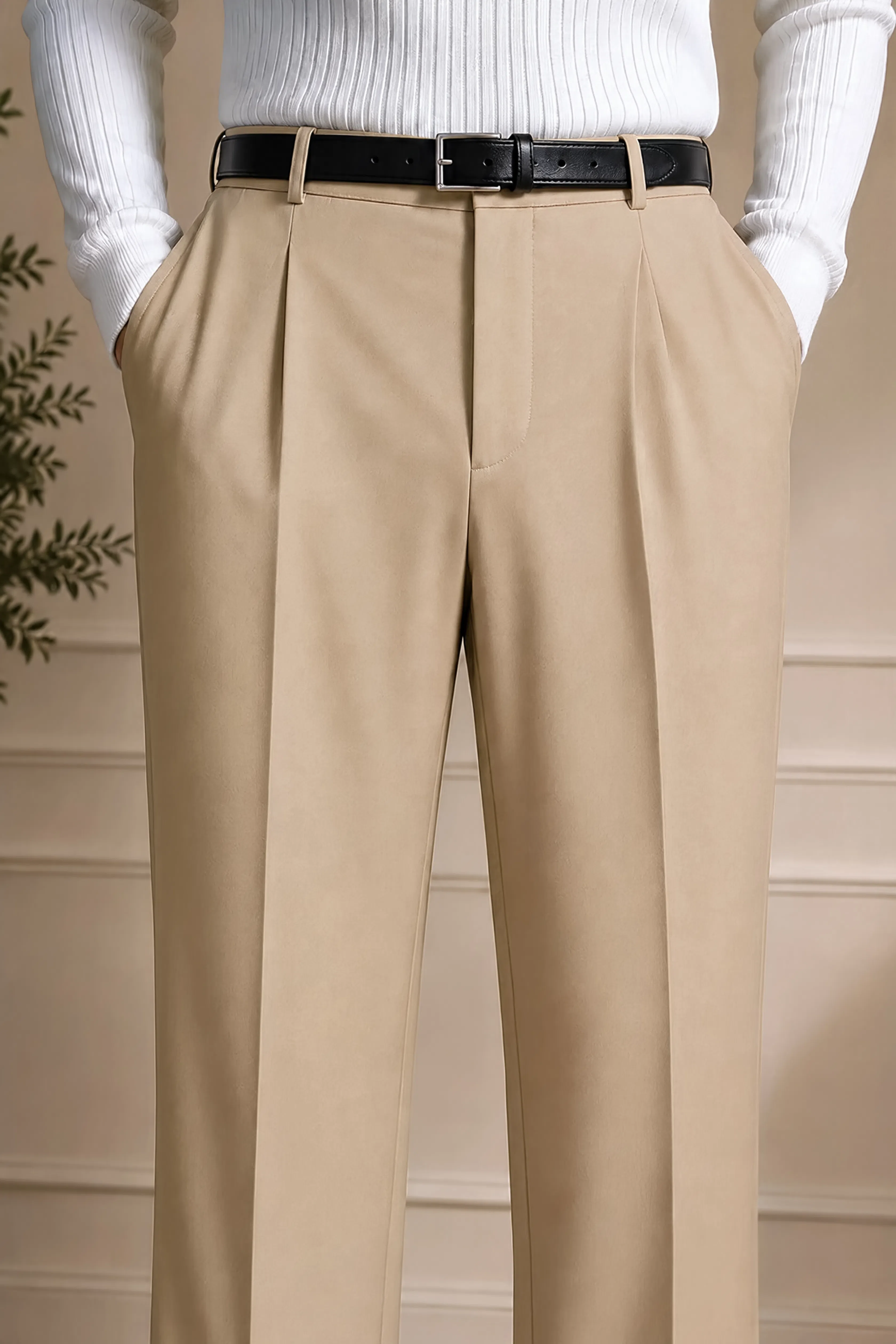 Beige dress pants with pleated front and black belt with buckle
