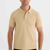 Men's beige polo T-shirt with short sleeves and buttoned fold-over collar