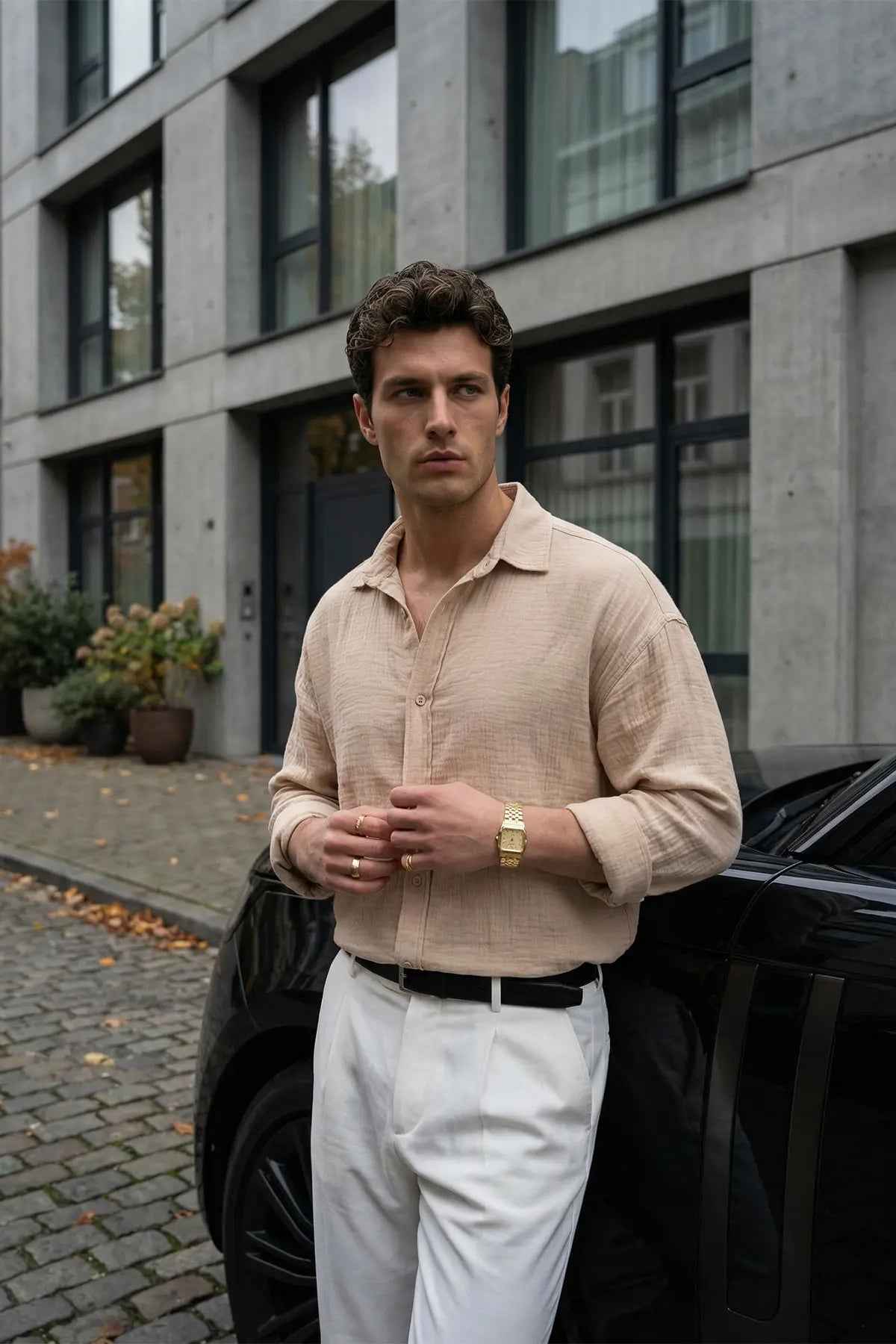 Men's LV beige button-up shirt with collar, long sleeves, and chest button details