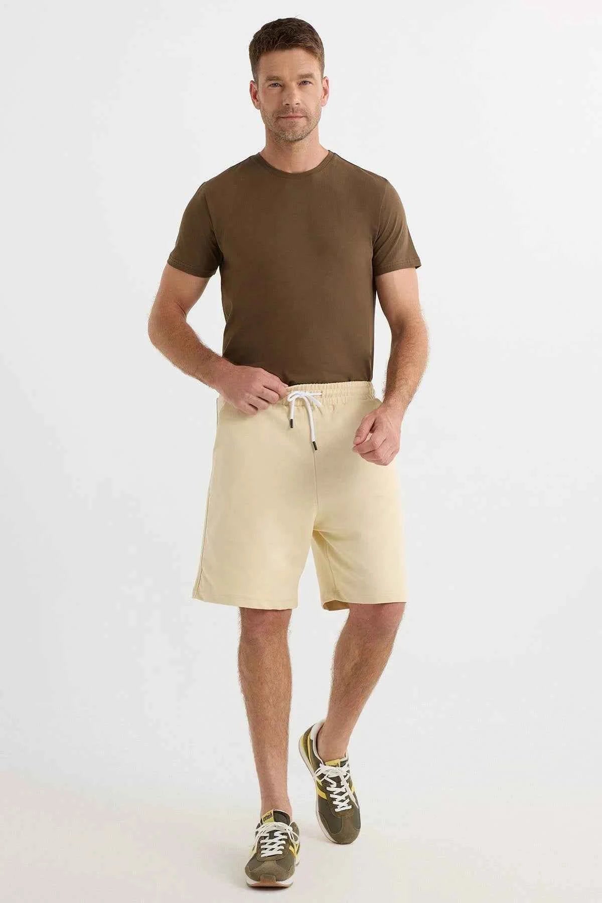Men's light beige shorts with drawstring waist and two side pockets