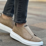 Beige low-top slip-on sneakers with white rubber sole, side view, pull tab