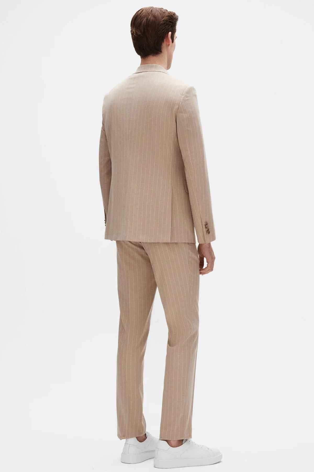 Beige striped men’s suit trousers and blazer set, back view.