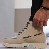 Beige suede lace-up boots showing side profile, padded collar, and lug sole