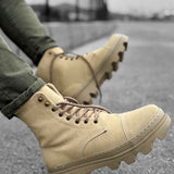 Men's beige suede lace-up boots, side view with textured lug outsole
