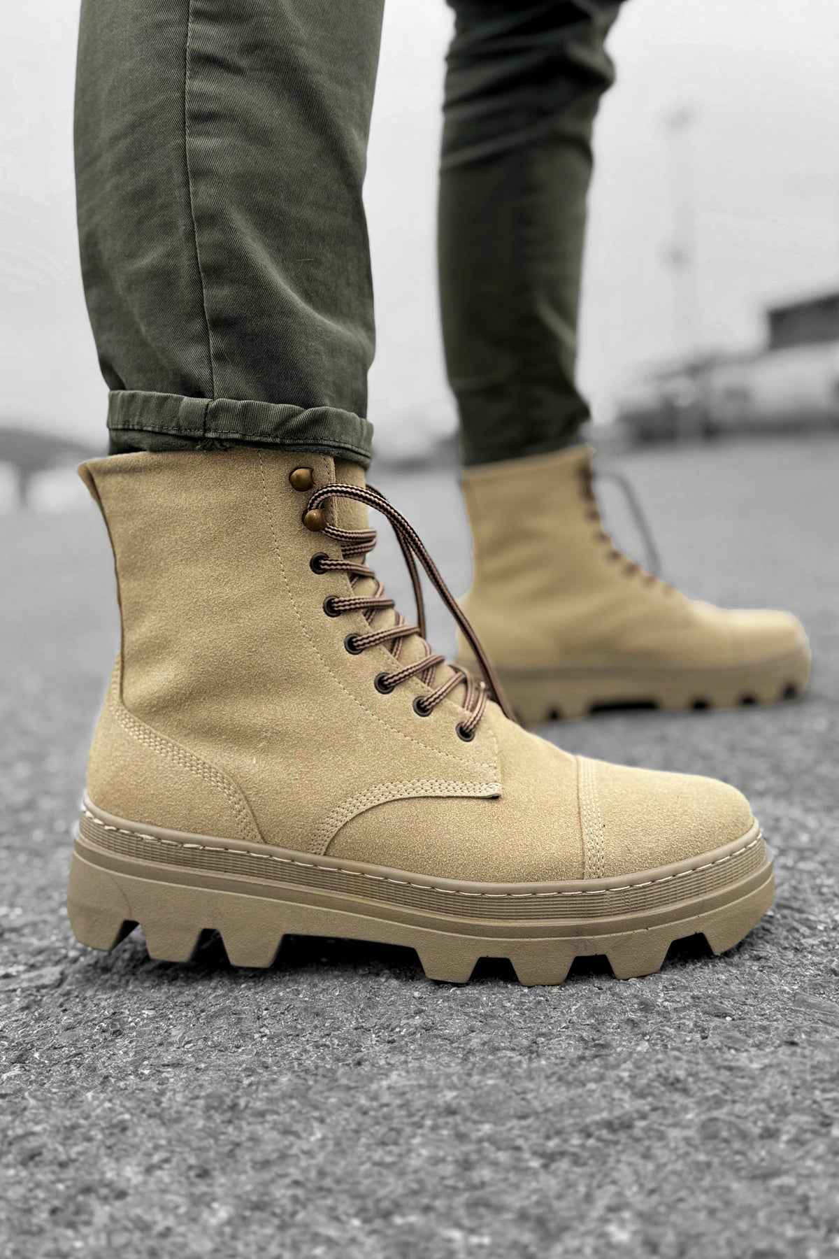 Men's beige suede lace-up boots with padded collar and rubber lug sole