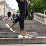Men's beige suede ankle boots on steps, white sole