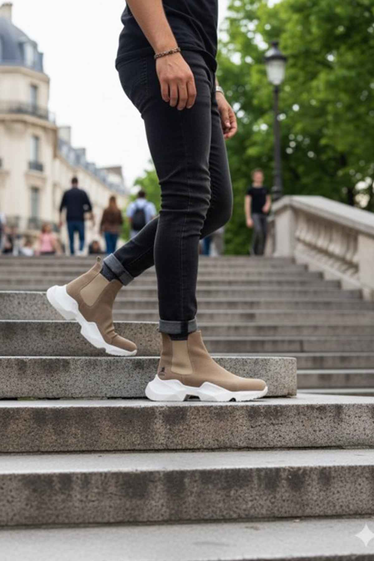 Men's beige suede ankle boots on steps, white sole