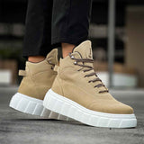 Beige suede lace-up boots with thick white platform sole and side profile