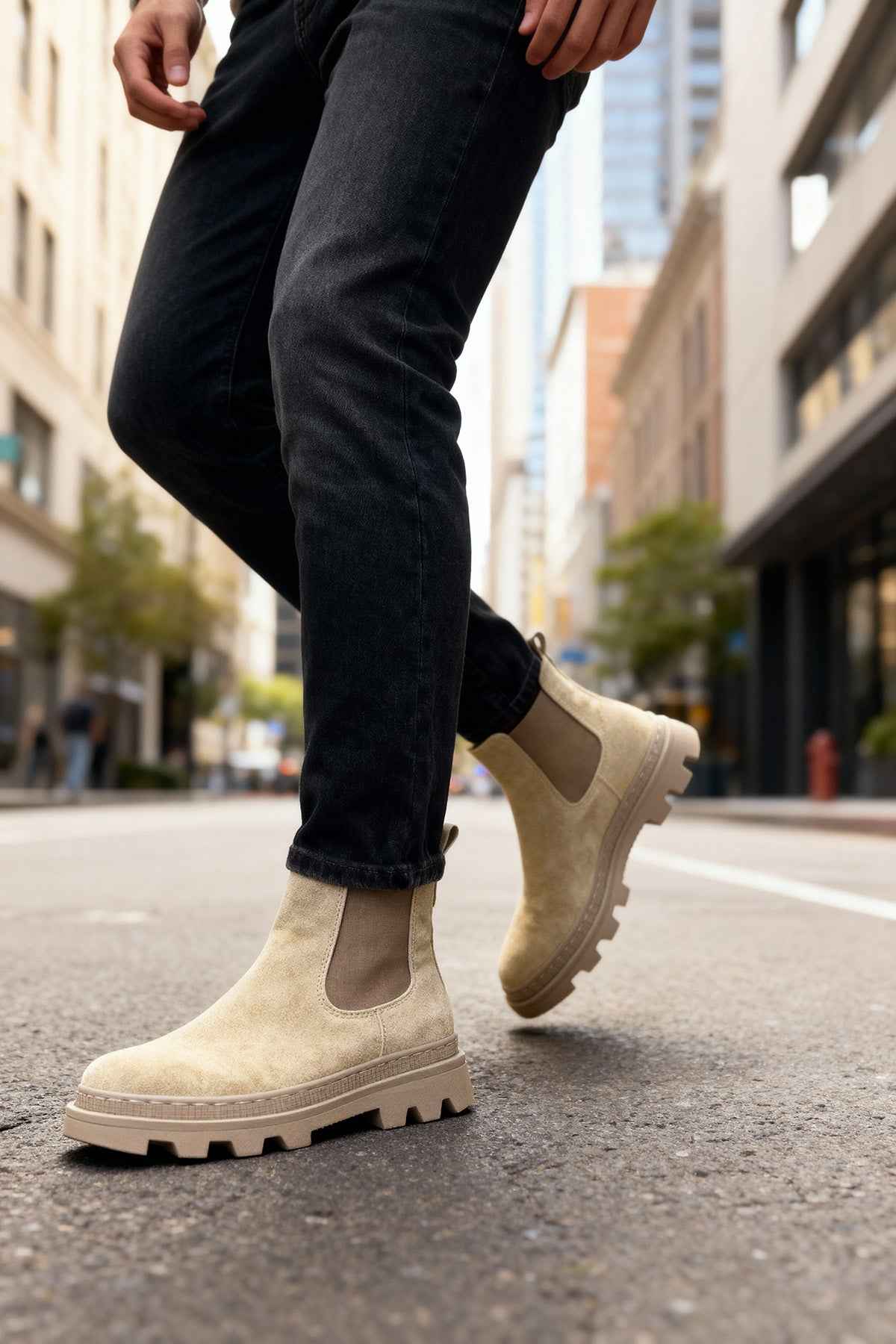 Men's beige suede Chelsea boots with side elastic and lug sole, ankle height.