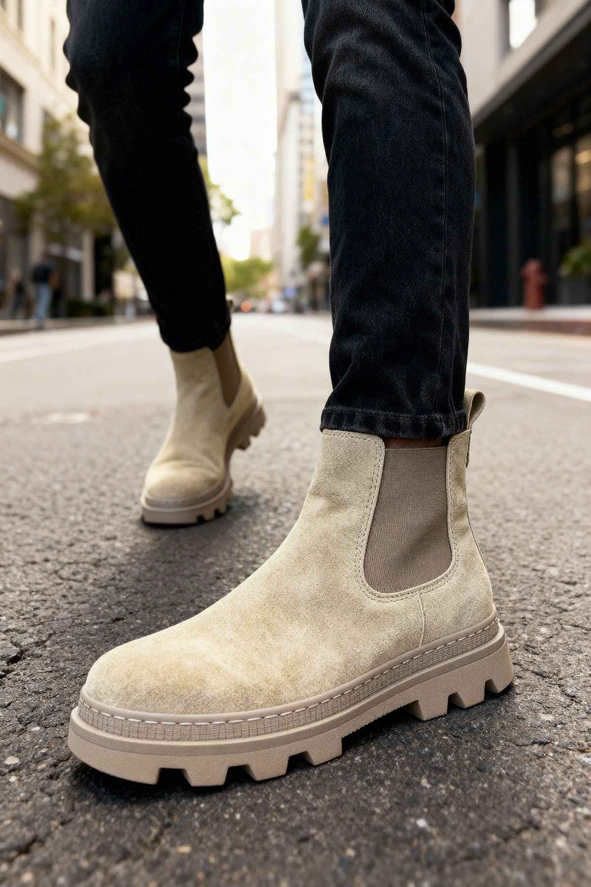 Men's beige suede ankle boots with elastic gore and chunky tread sole.