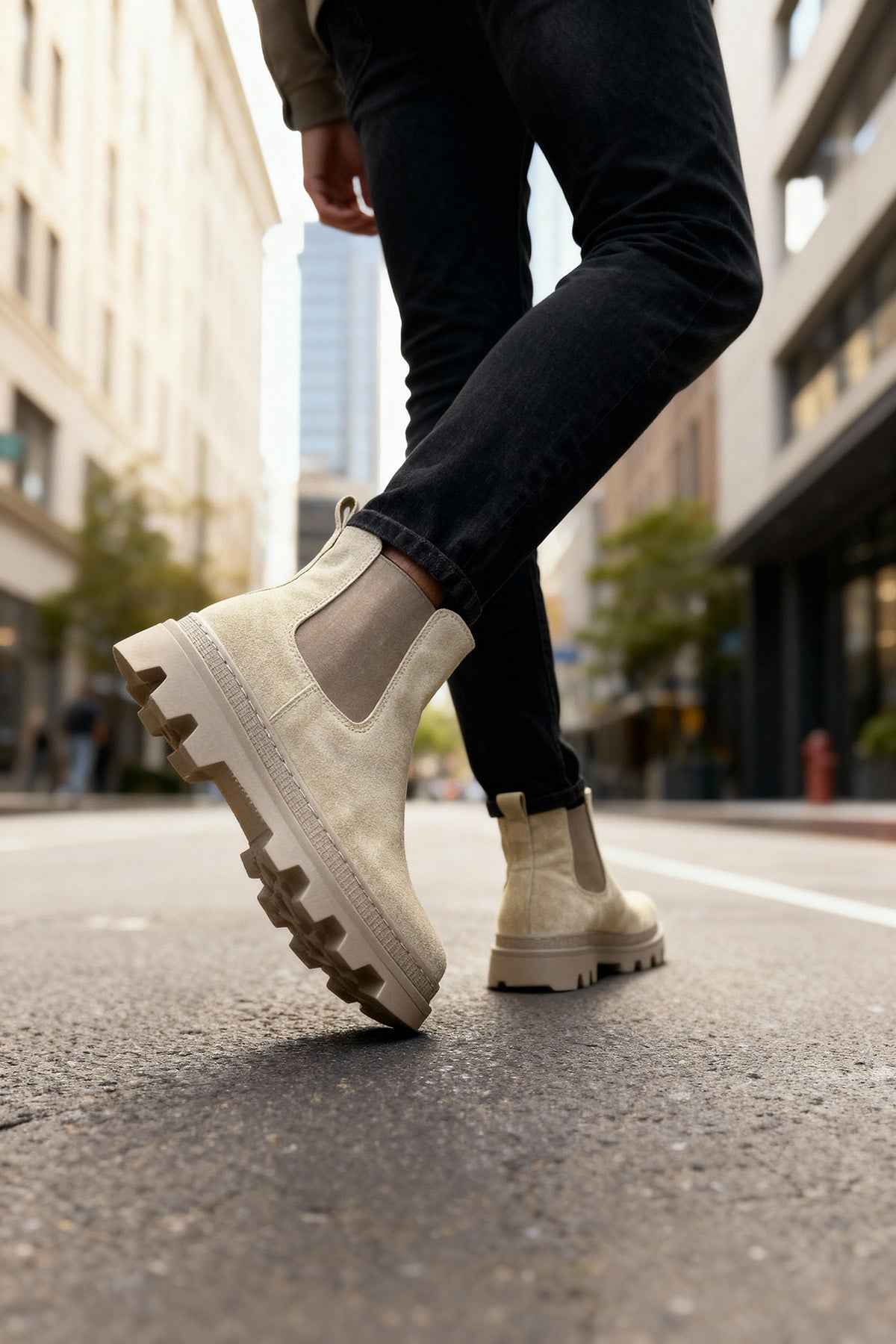 Men's beige suede boots, side view, with elastic panel and lugged outsole.
