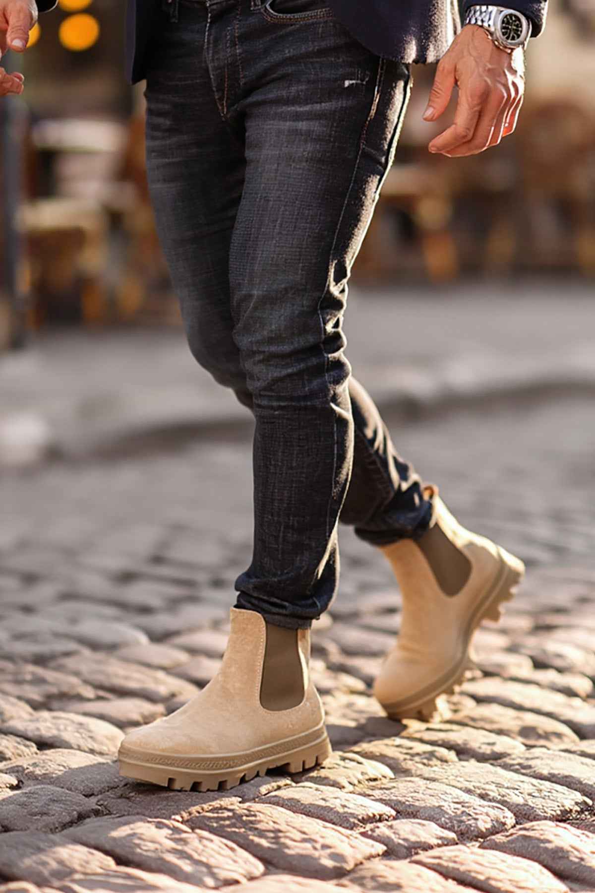 Men's beige suede boots with pull-on elastic panels and rugged lug sole.
