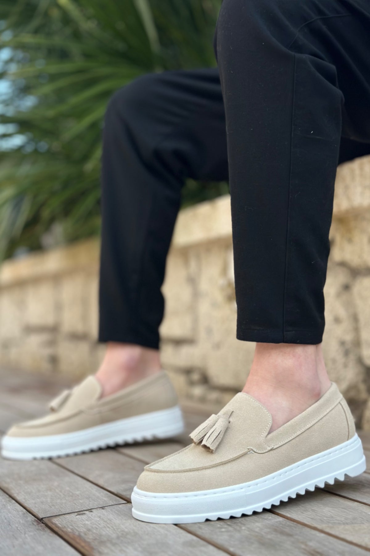 Beige suede loafers, side angle with tassel and textured white sole