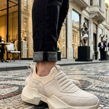 Beige suede sneakers with ridged slip-on strap and thick geometric outsole