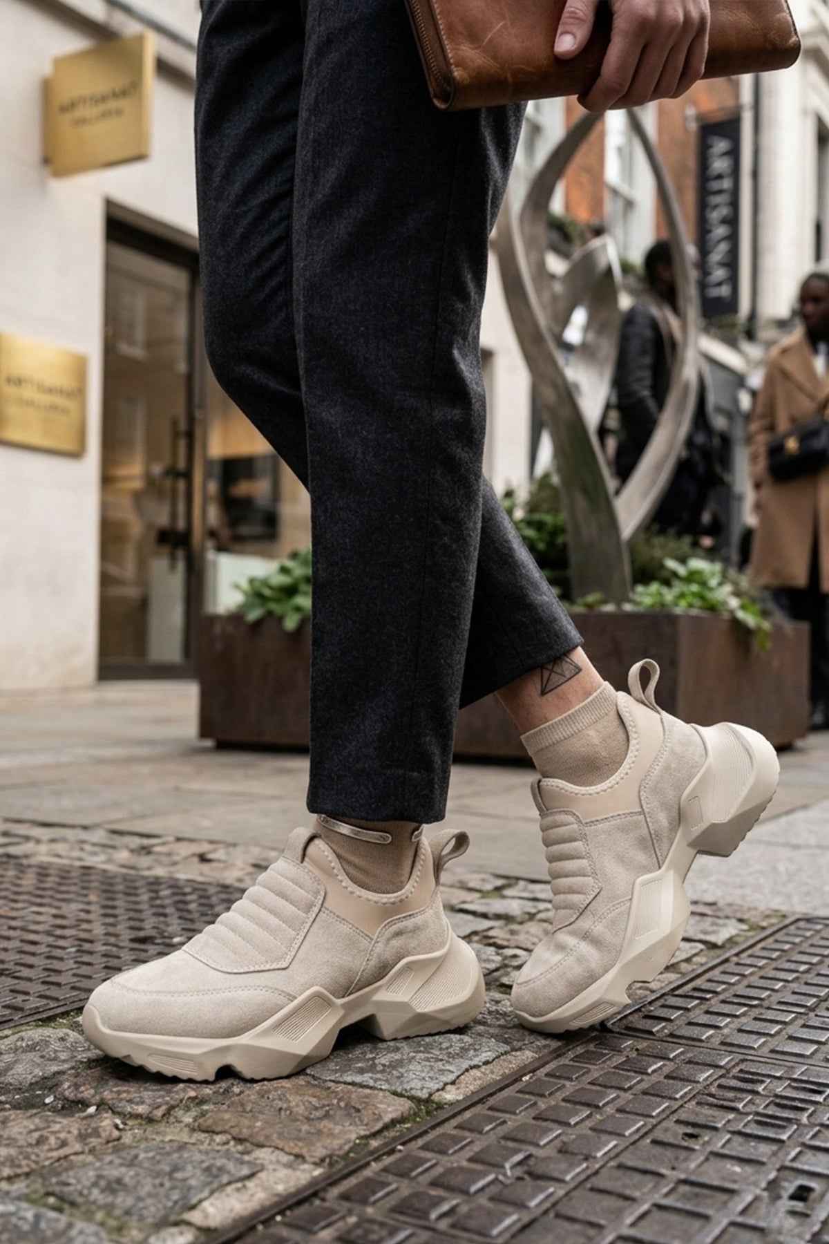 Beige suede sneakers with elastic side inserts and chunky platform heel