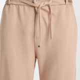 Beige sweatpants with buttoned waistband and drawstring front