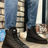 Black lace-up ankle boots with padded collar and tread sole