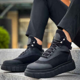 Black lace-up ankle boots with chunky rubber sole and side panels