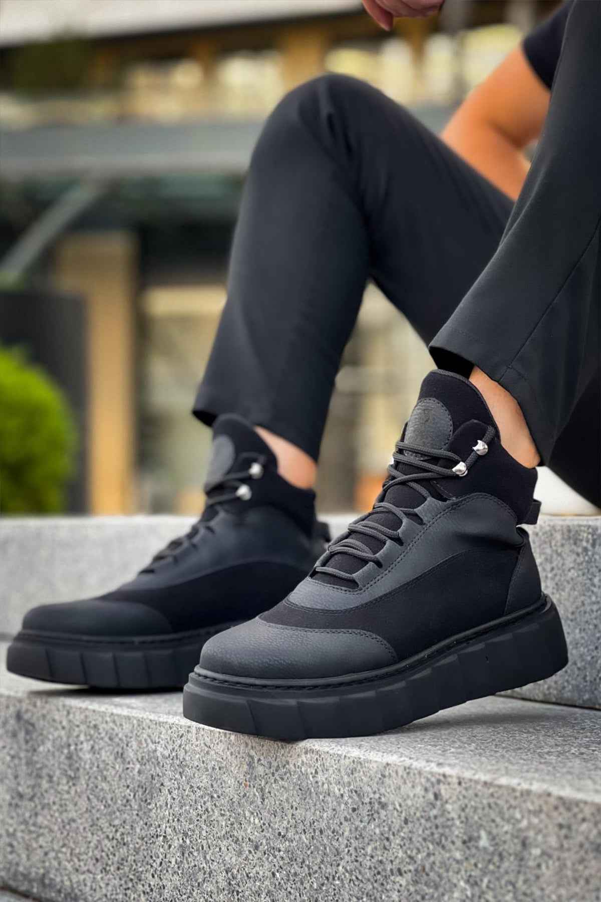 Black lace-up ankle boots with chunky rubber sole and side panels